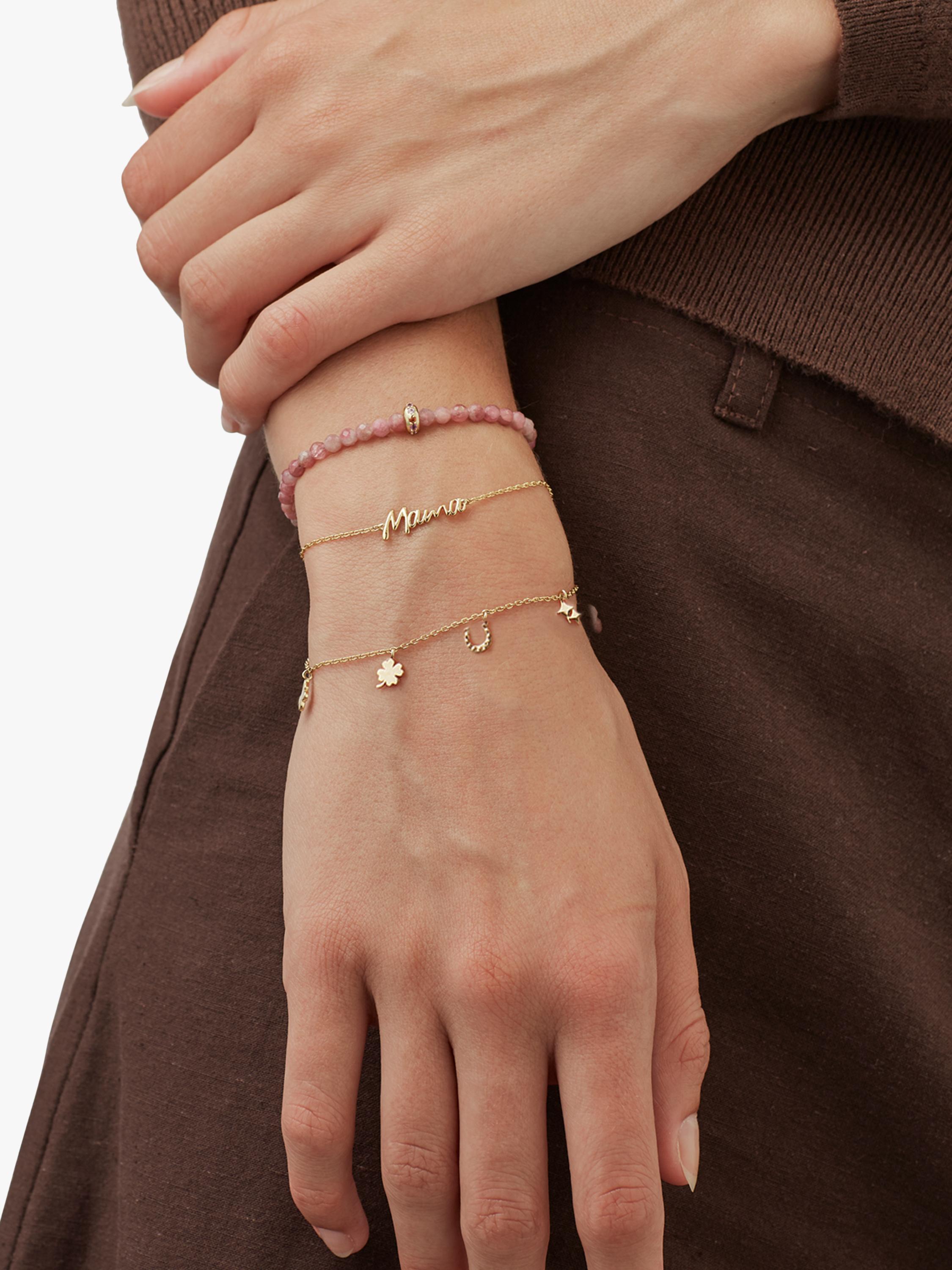 Estella Bartlett gold charm bracelet with lucky charms, imported from the UK