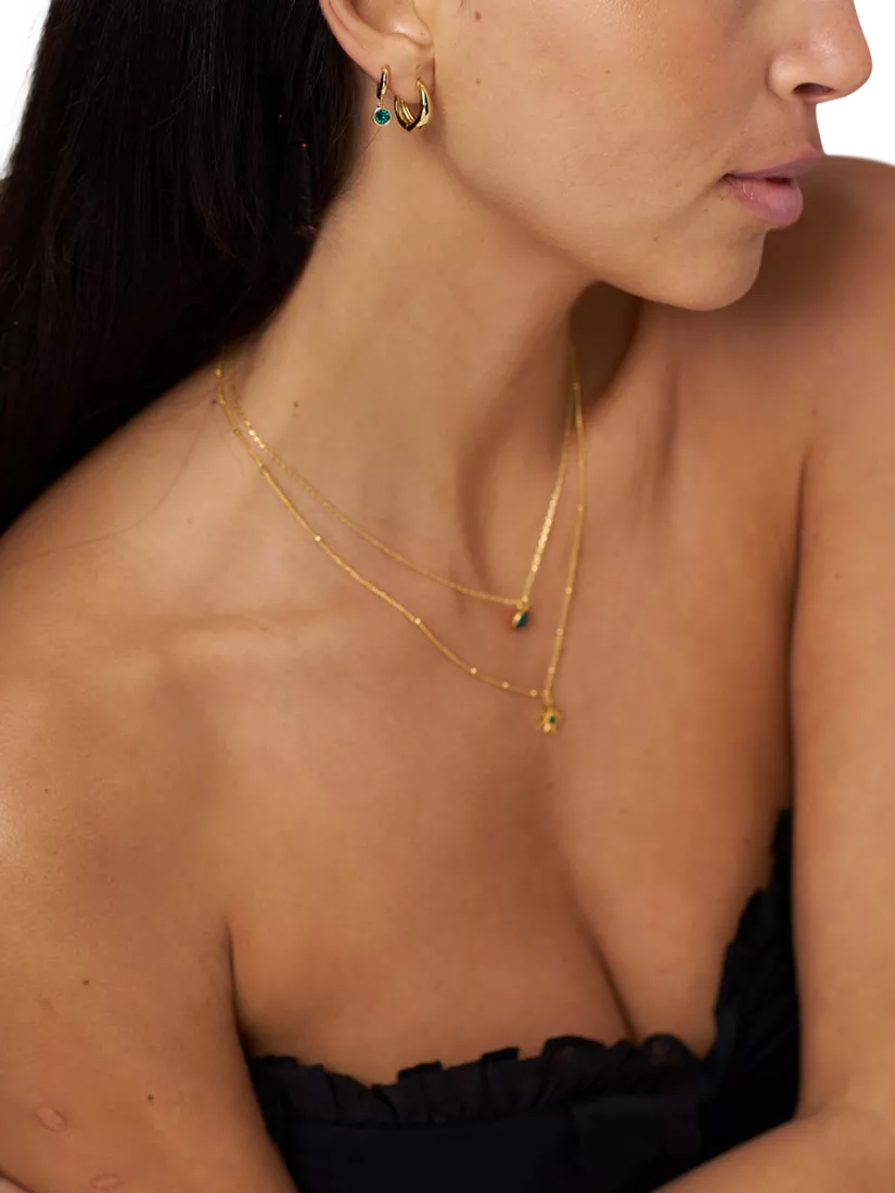Orelia Swarovski huggie hoop earrings gold emerald - British product