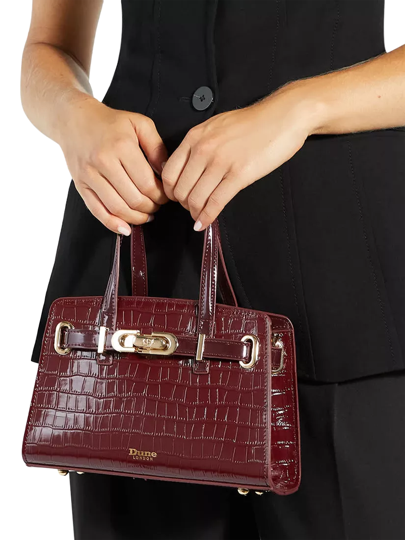 Dune London burgundy leather grab bag with belted detail, imported from the UK