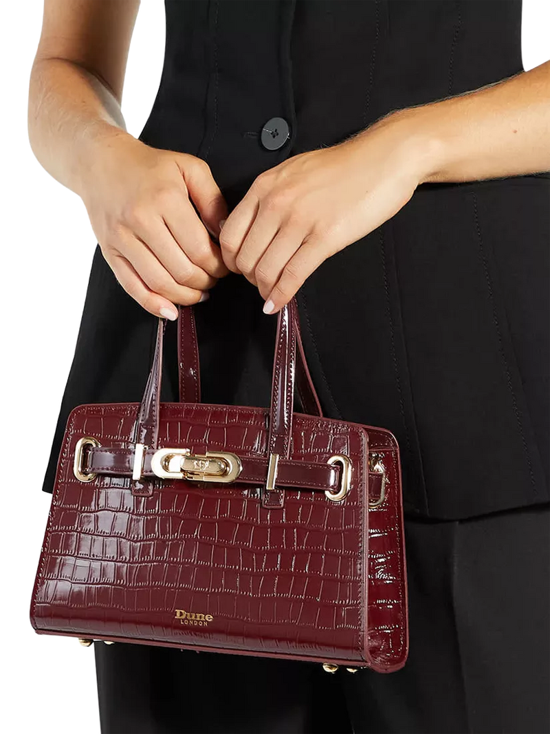 Dune London burgundy leather grab bag with belted detail, imported from the UK