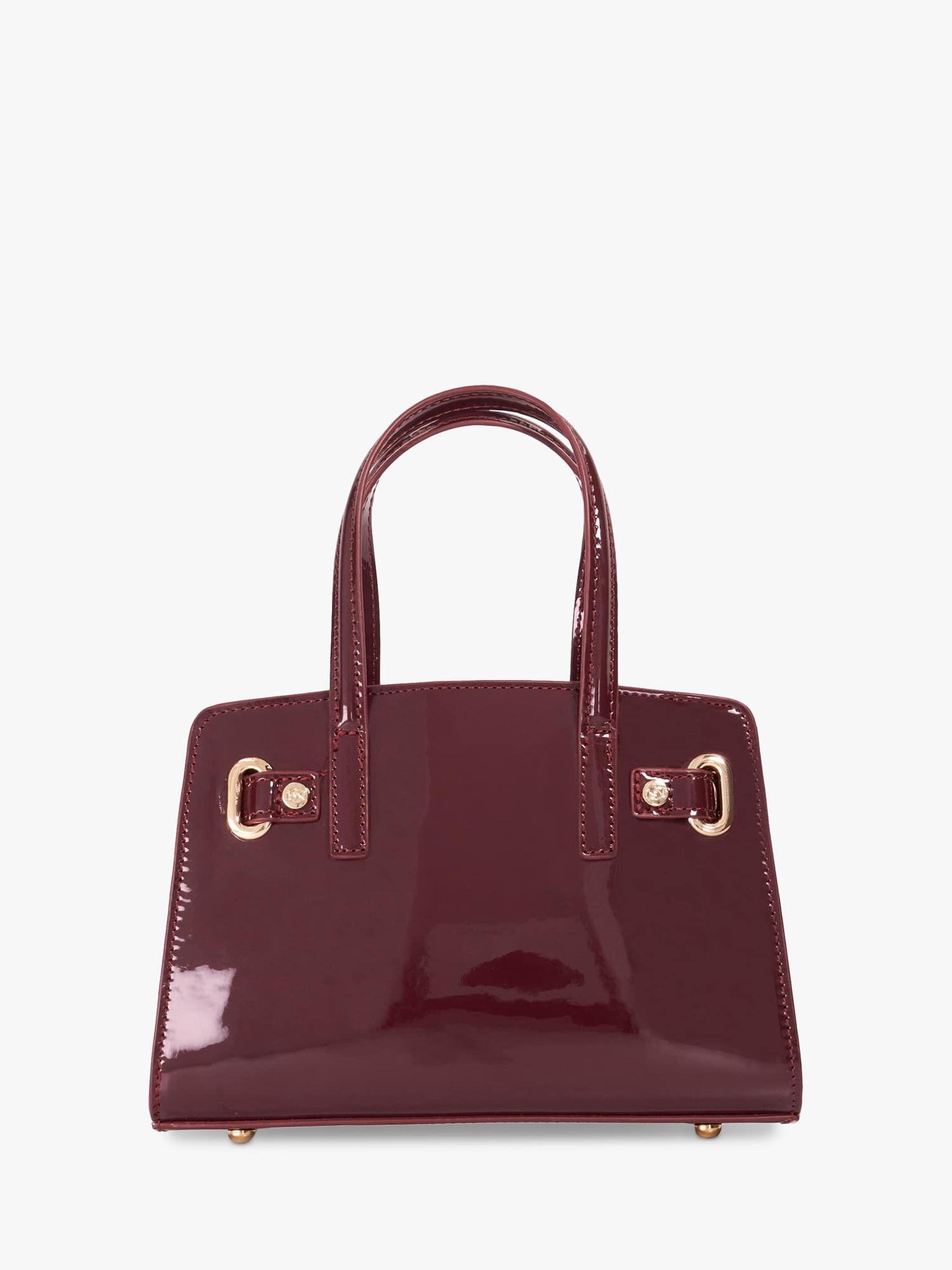 Dune London burgundy leather grab bag with belted detail, imported from the UK