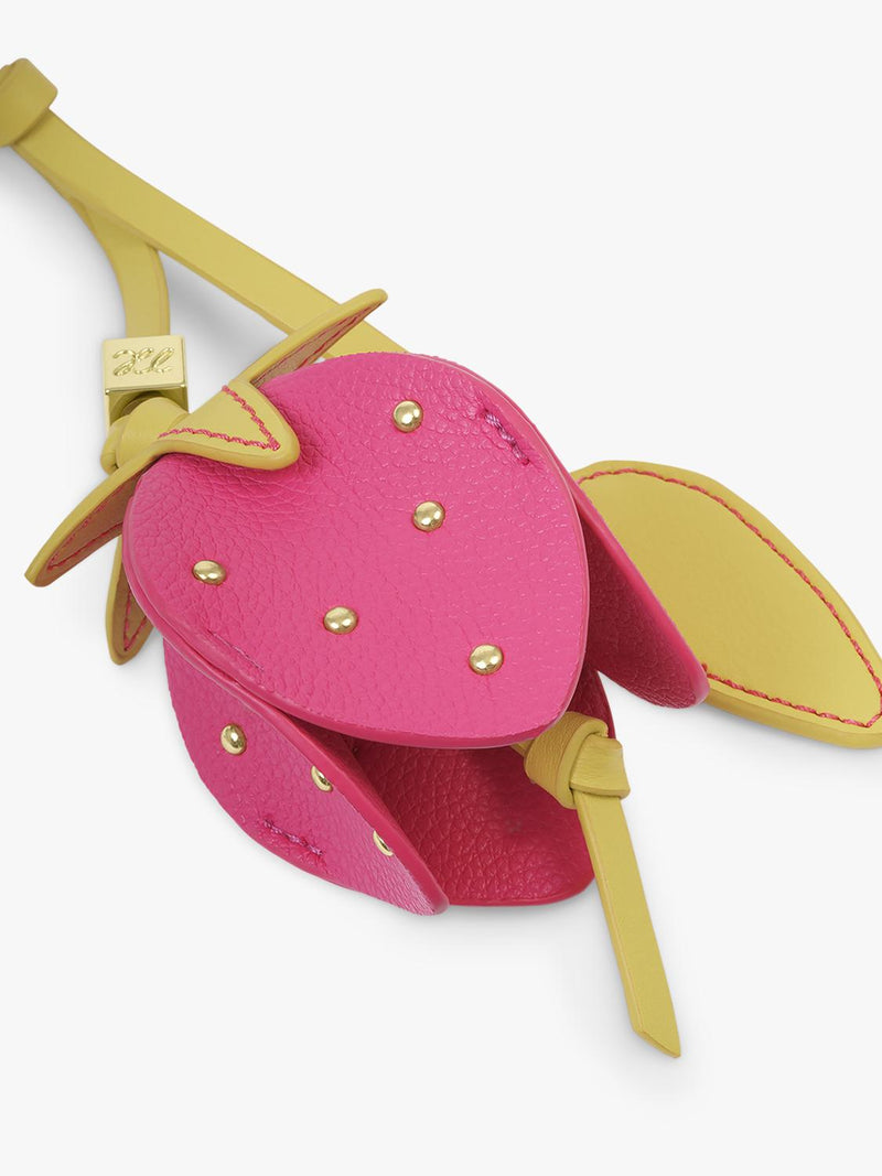 Katie Loxton strawberry bag charm in chartreuse magenta, imported from the UK