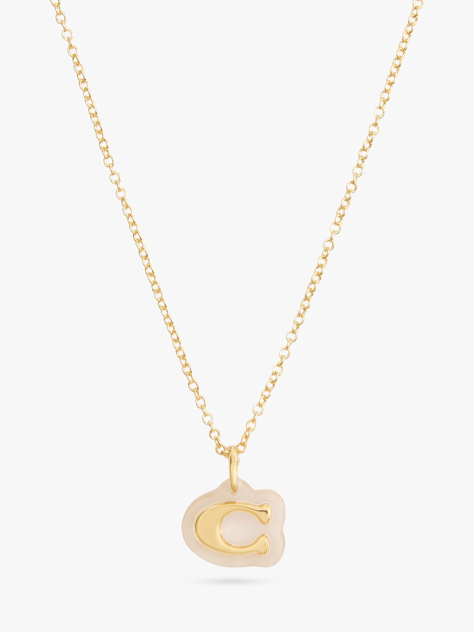 Coach gold pendant necklace with lucite and cubic zirconia, imported from the UK
