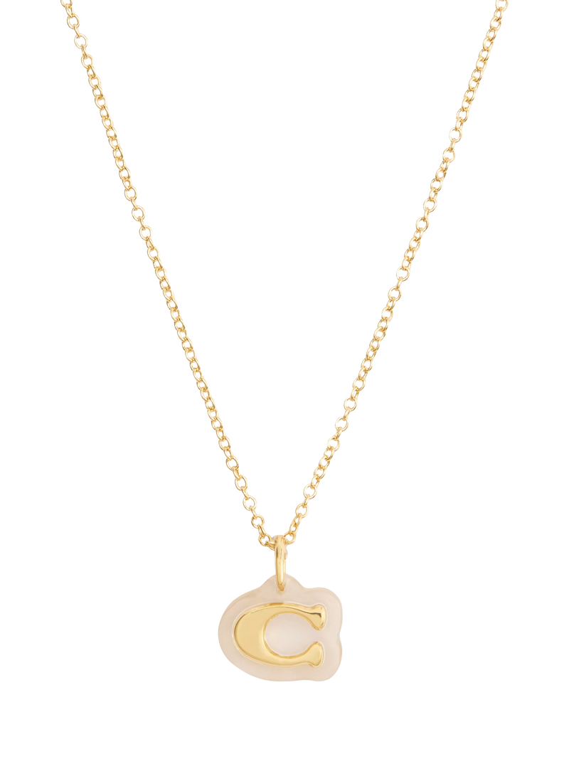 Coach gold pendant necklace with lucite and cubic zirconia, imported from the UK