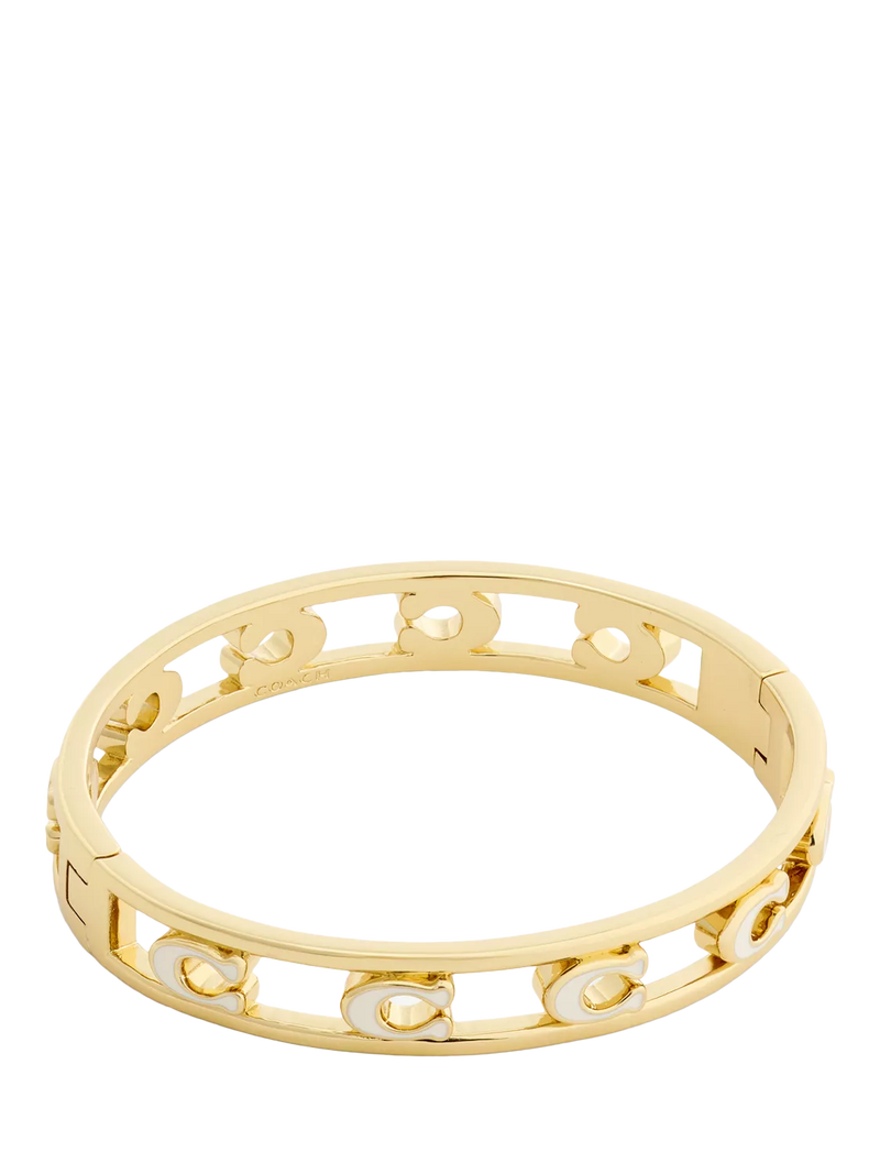 Coach bangle bracelet in chalk with gold toned metal and enamel, UK version