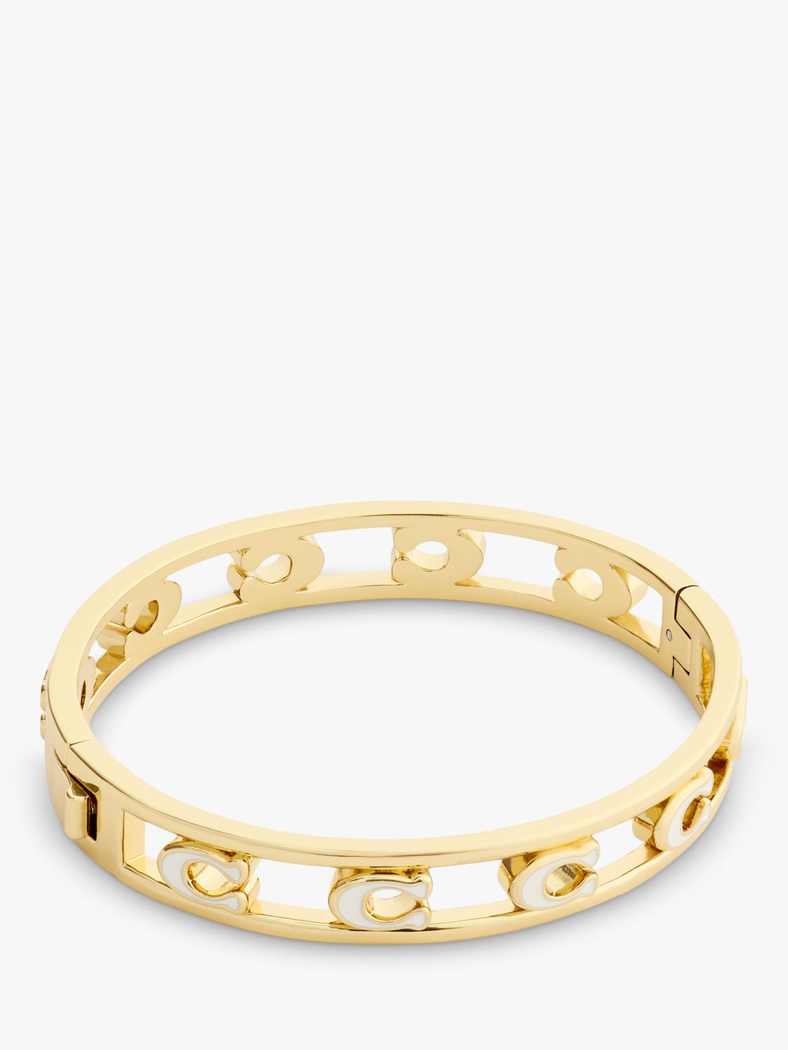 Coach bangle bracelet in chalk with gold toned metal and enamel, UK version