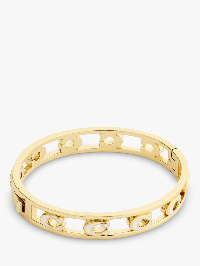 Coach bangle bracelet in chalk with gold toned metal and enamel, UK version