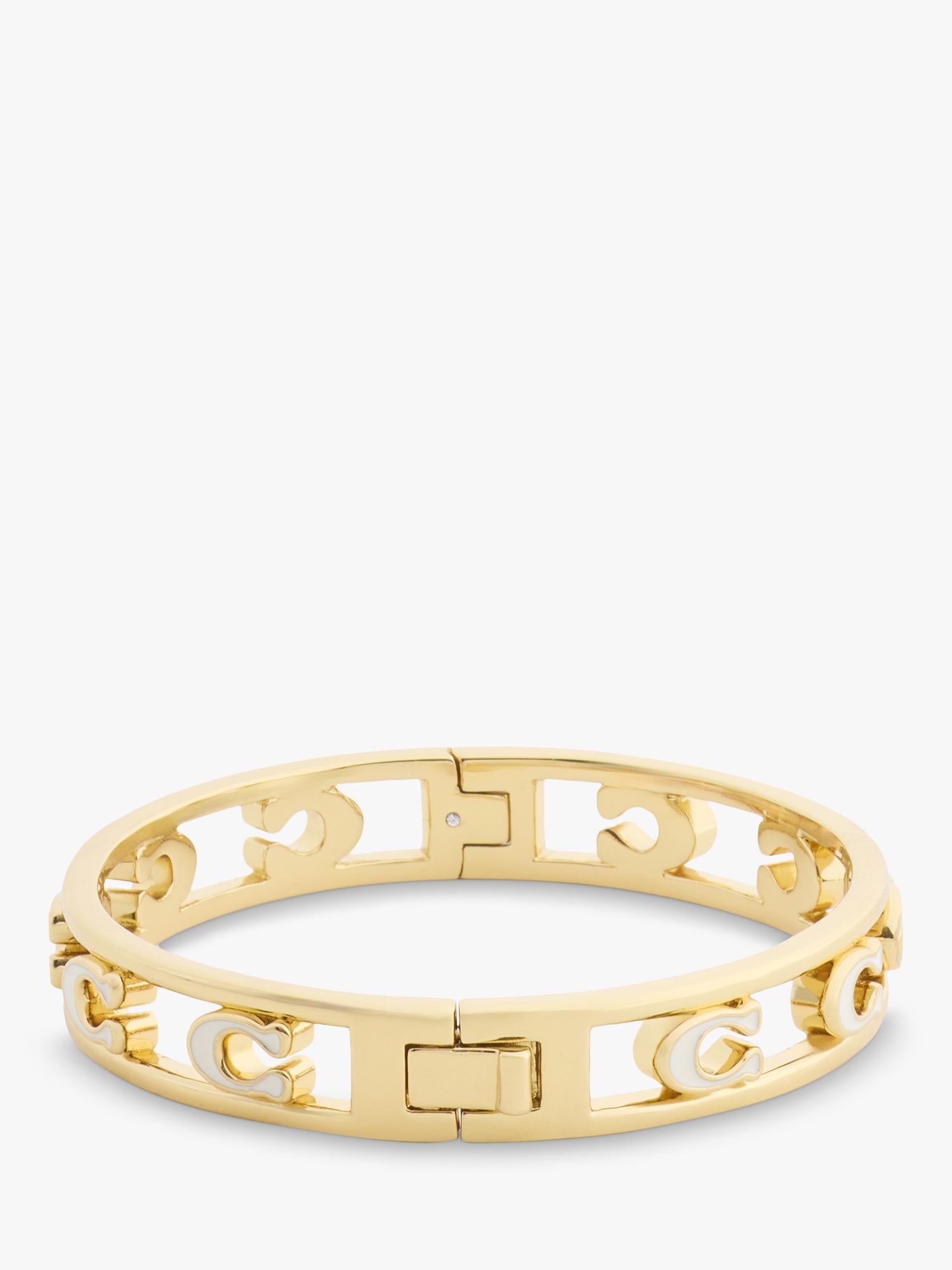 Coach bangle bracelet in chalk with gold toned metal and enamel, UK version