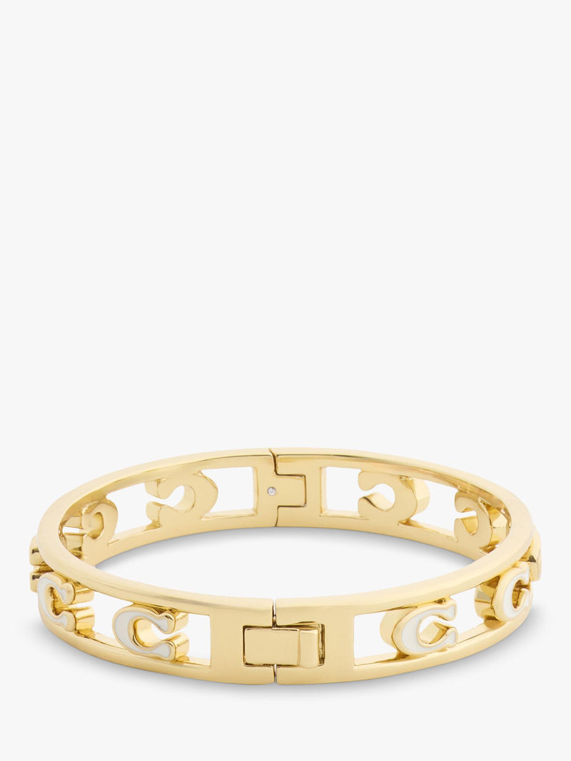 Coach bangle bracelet in chalk with gold toned metal and enamel, UK version