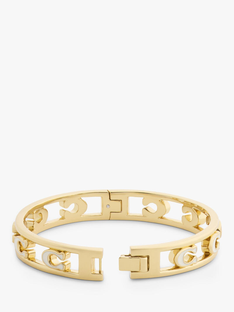 Coach bangle bracelet in chalk with gold toned metal and enamel, UK version