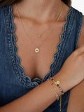 Estella Bartlett gold necklace with doodle flower pendant - British product