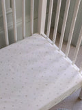 Avery Row cotbed fitted sheet nettle scatter pattern imported from the UK