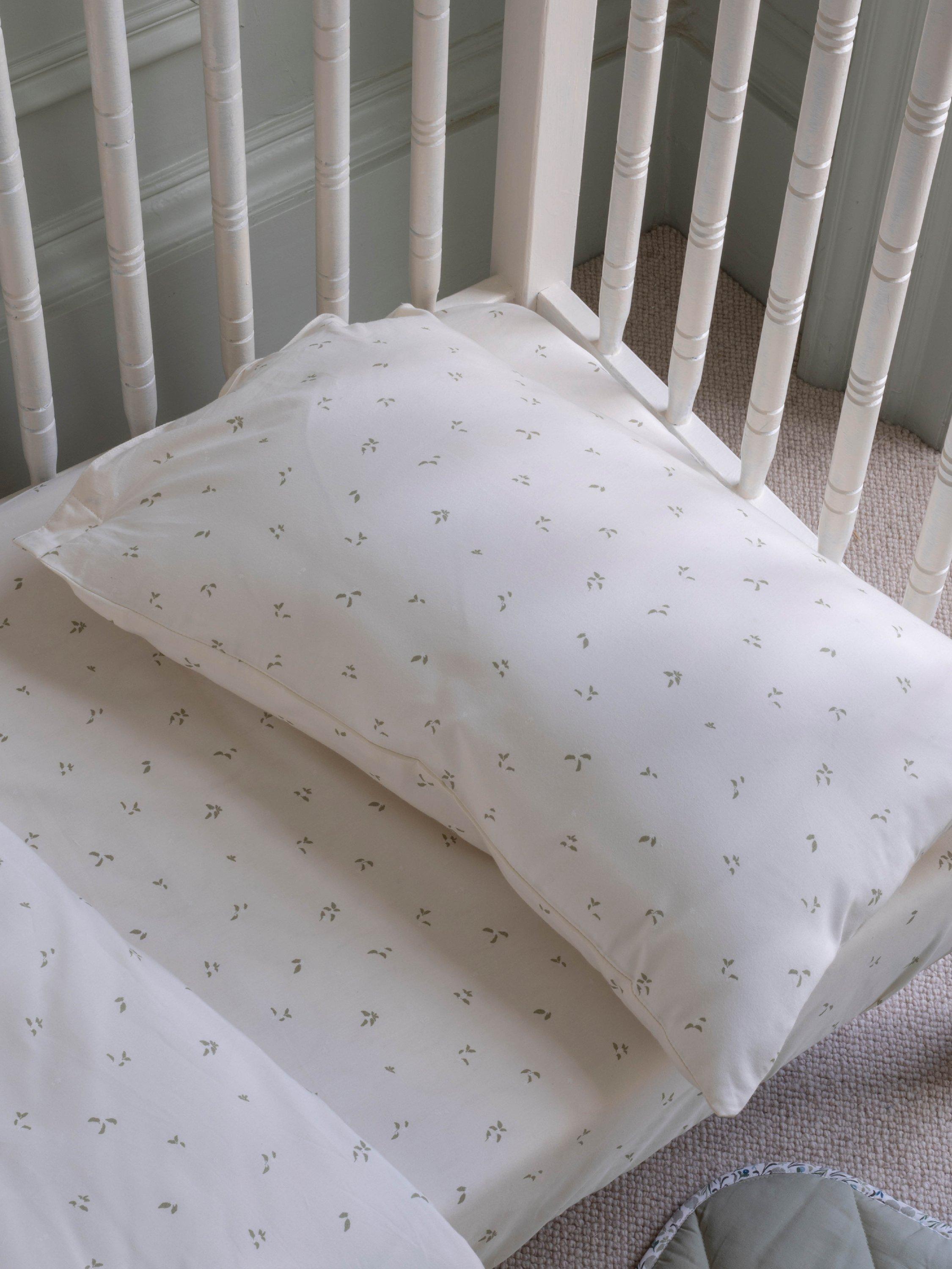 Avery Row cotbed fitted sheet nettle scatter pattern imported from the UK