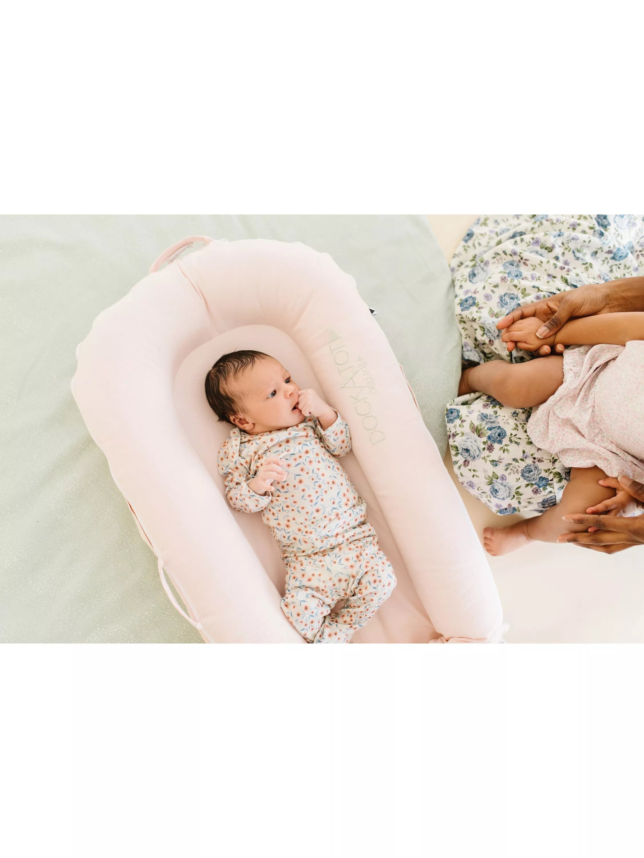DockATot Deluxe+ pink baby pod - British product