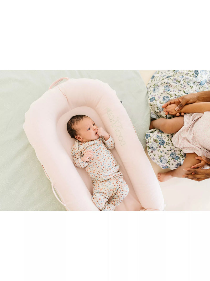DockATot Deluxe+ pink baby pod - British product