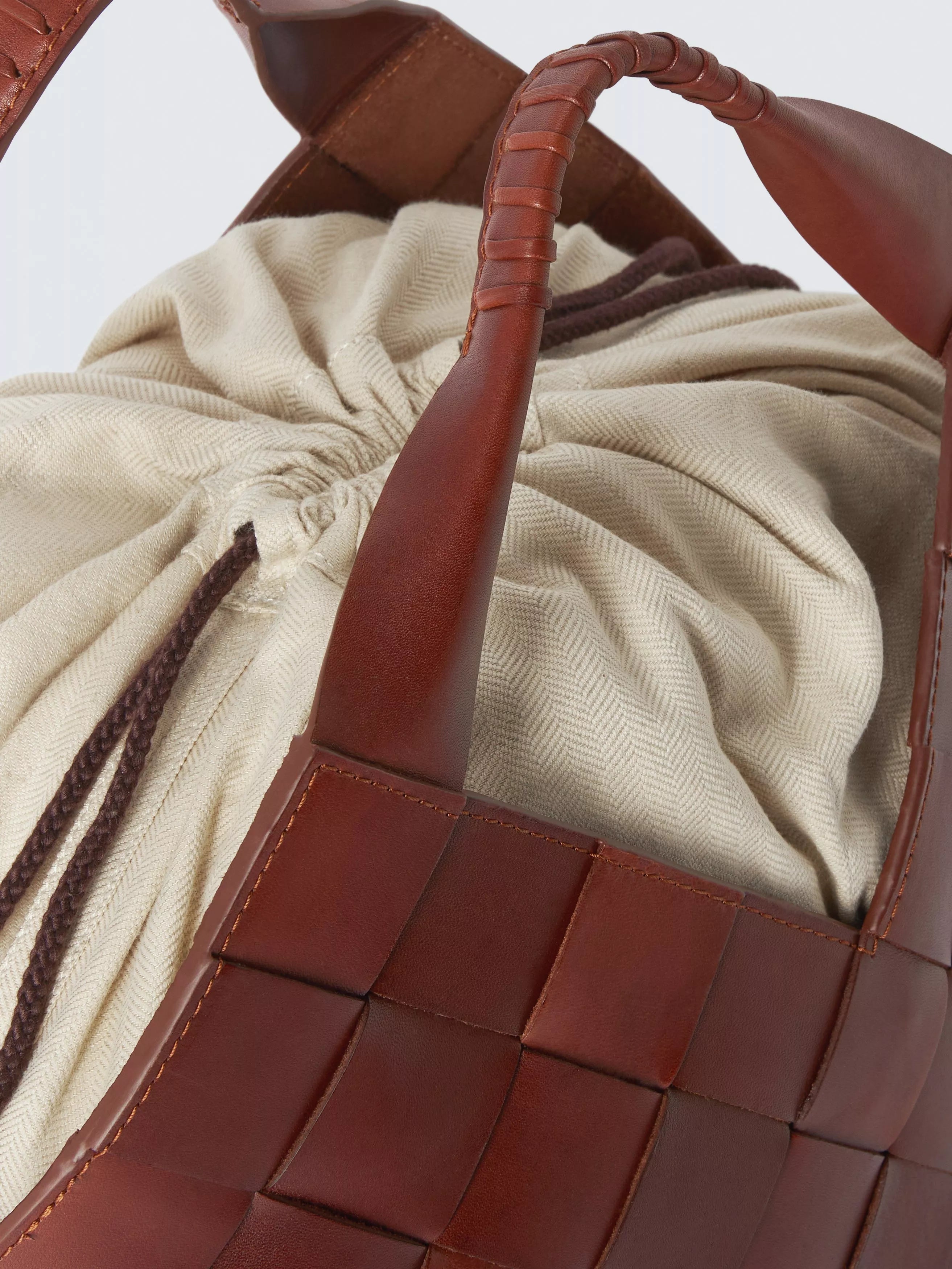 Dragon Diffusion Botteghe woven leather bucket bag, imported from the UK