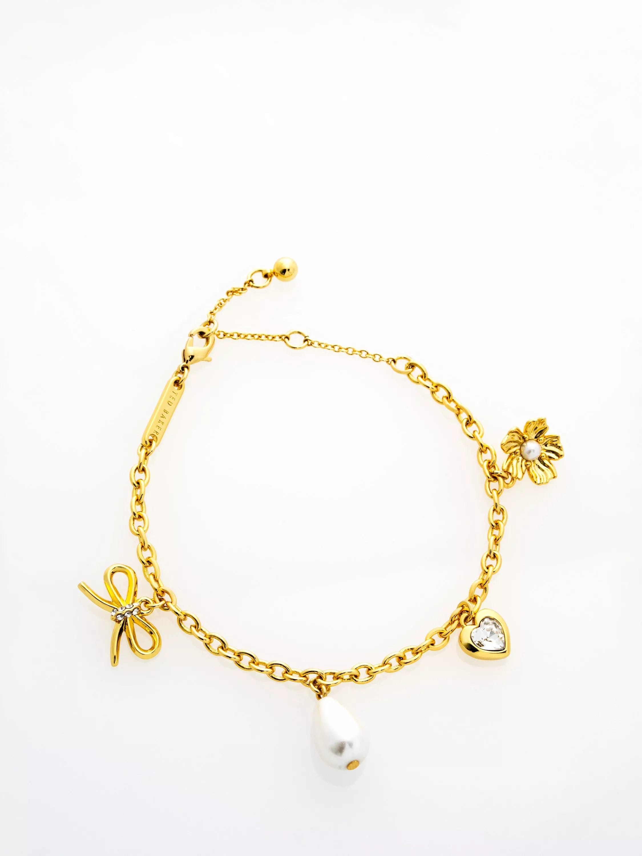 Ted Baker gold tone charm bracelet, imported from the UK