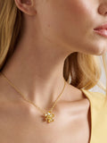 Ted Baker gold pendant necklace flower charm, imported from the UK