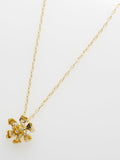 Ted Baker gold pendant necklace flower charm, imported from the UK