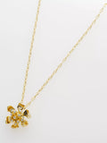 Ted Baker gold pendant necklace flower charm, imported from the UK