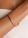 Astrid & Miyu gold wave bangle from UK - British product