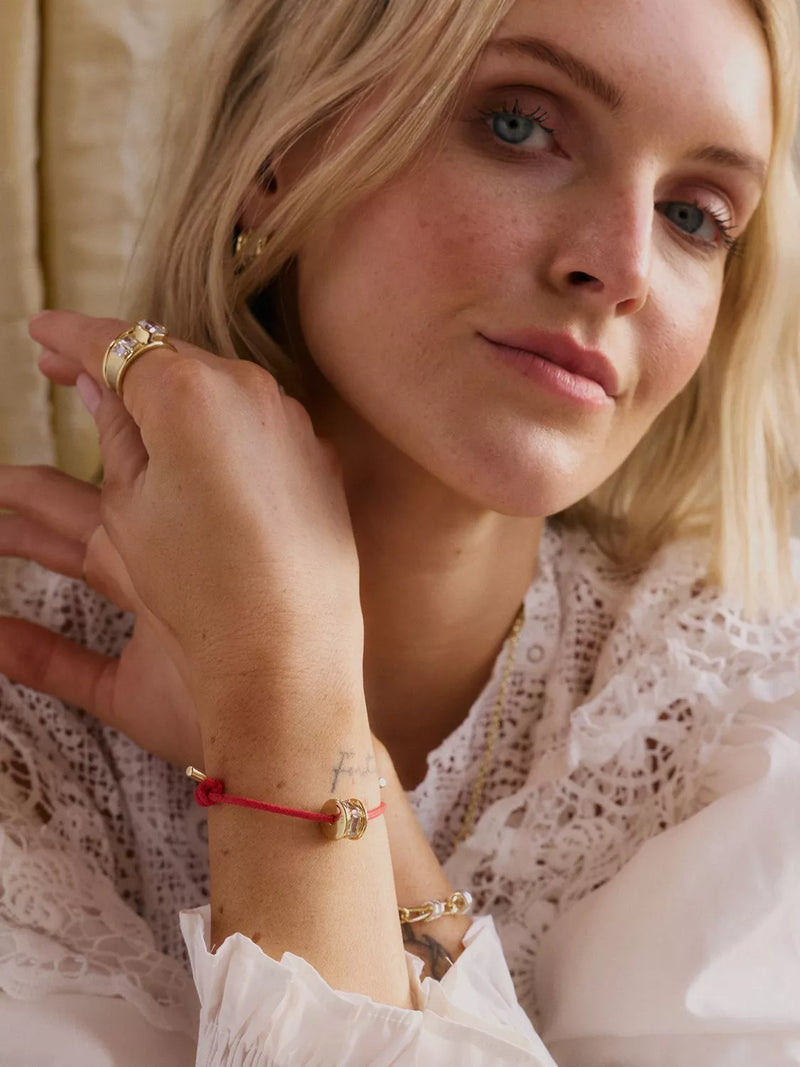 Daisy London red cord crystal bead bracelet with gold plating, imported from the UK