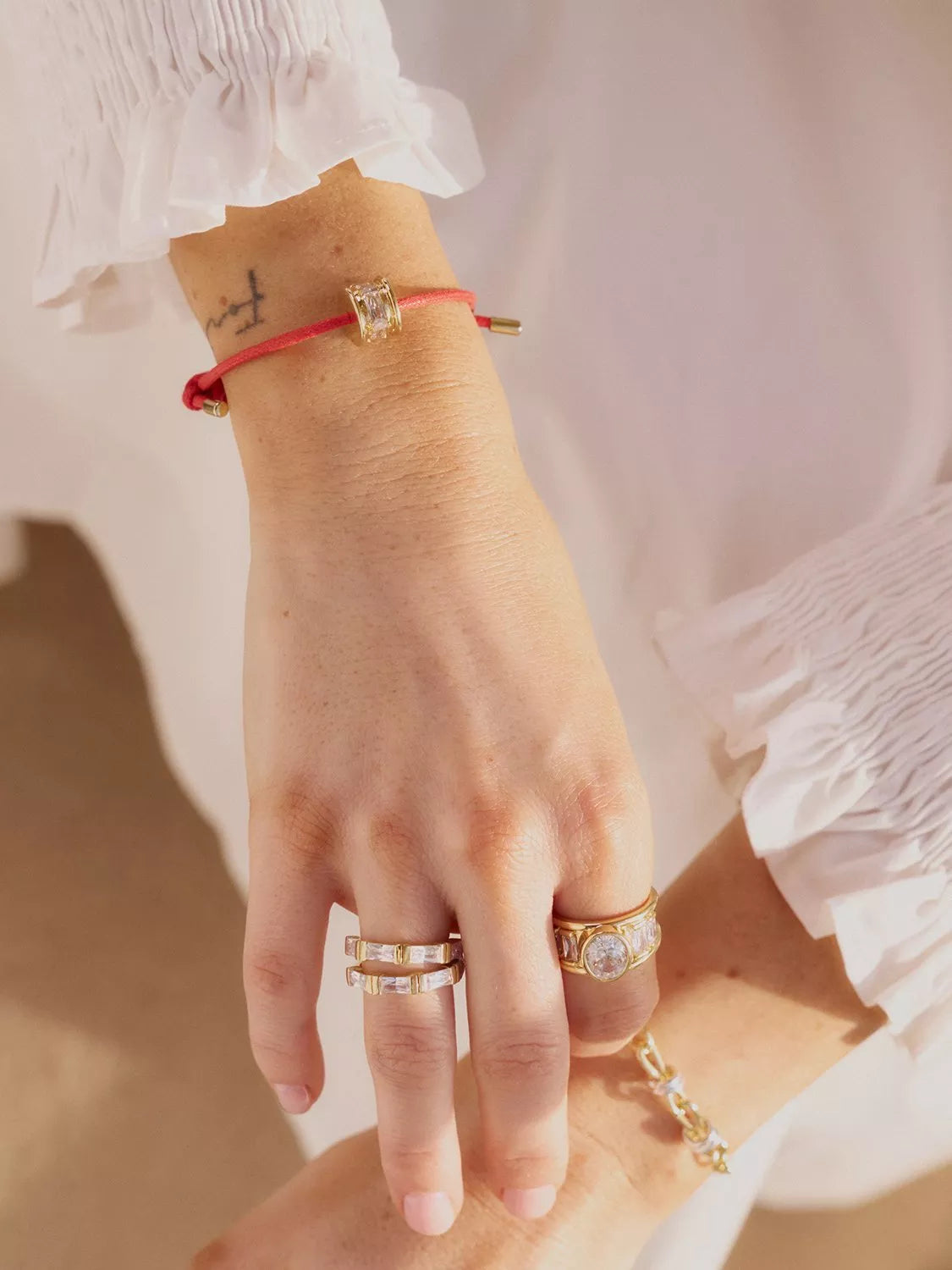 Daisy London red cord crystal bead bracelet with gold plating, imported from the UK