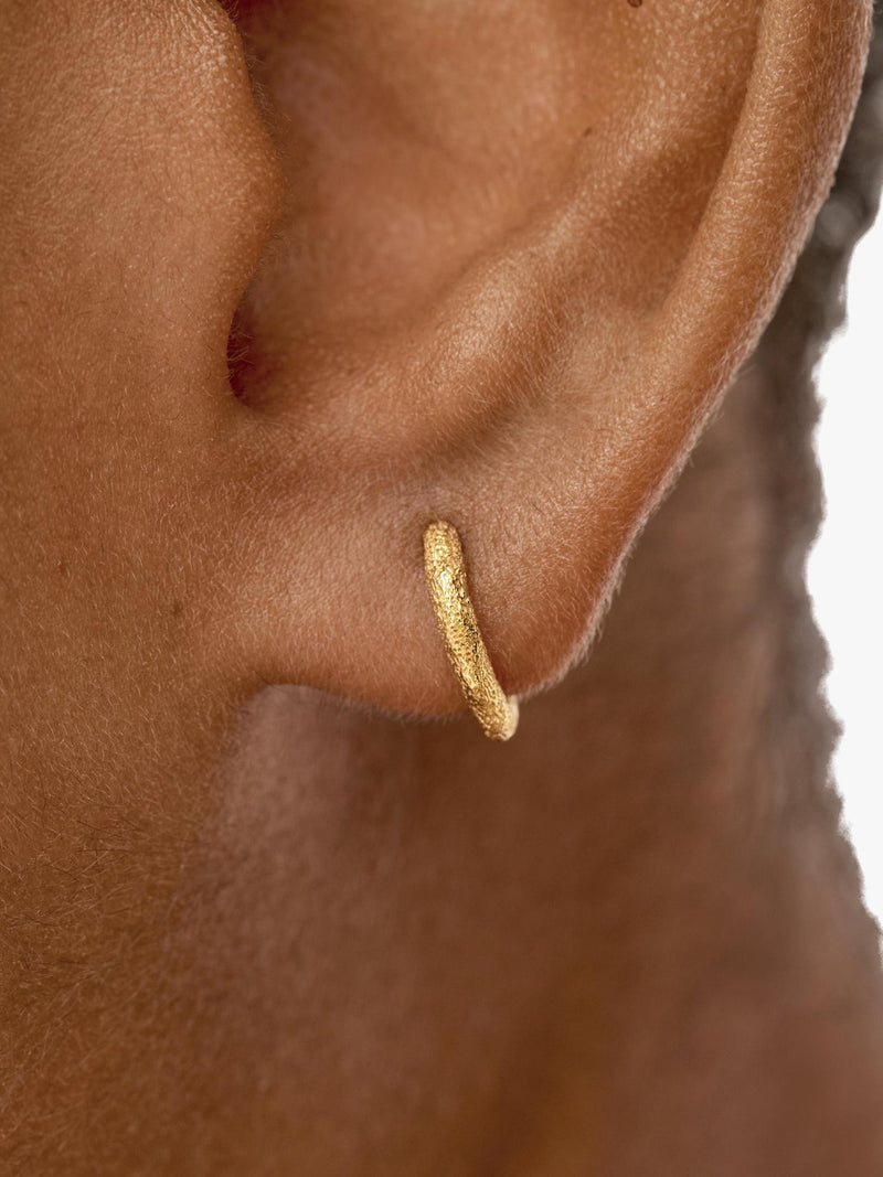 Monica Vinader gold mini huggie hoop earrings, imported from the UK