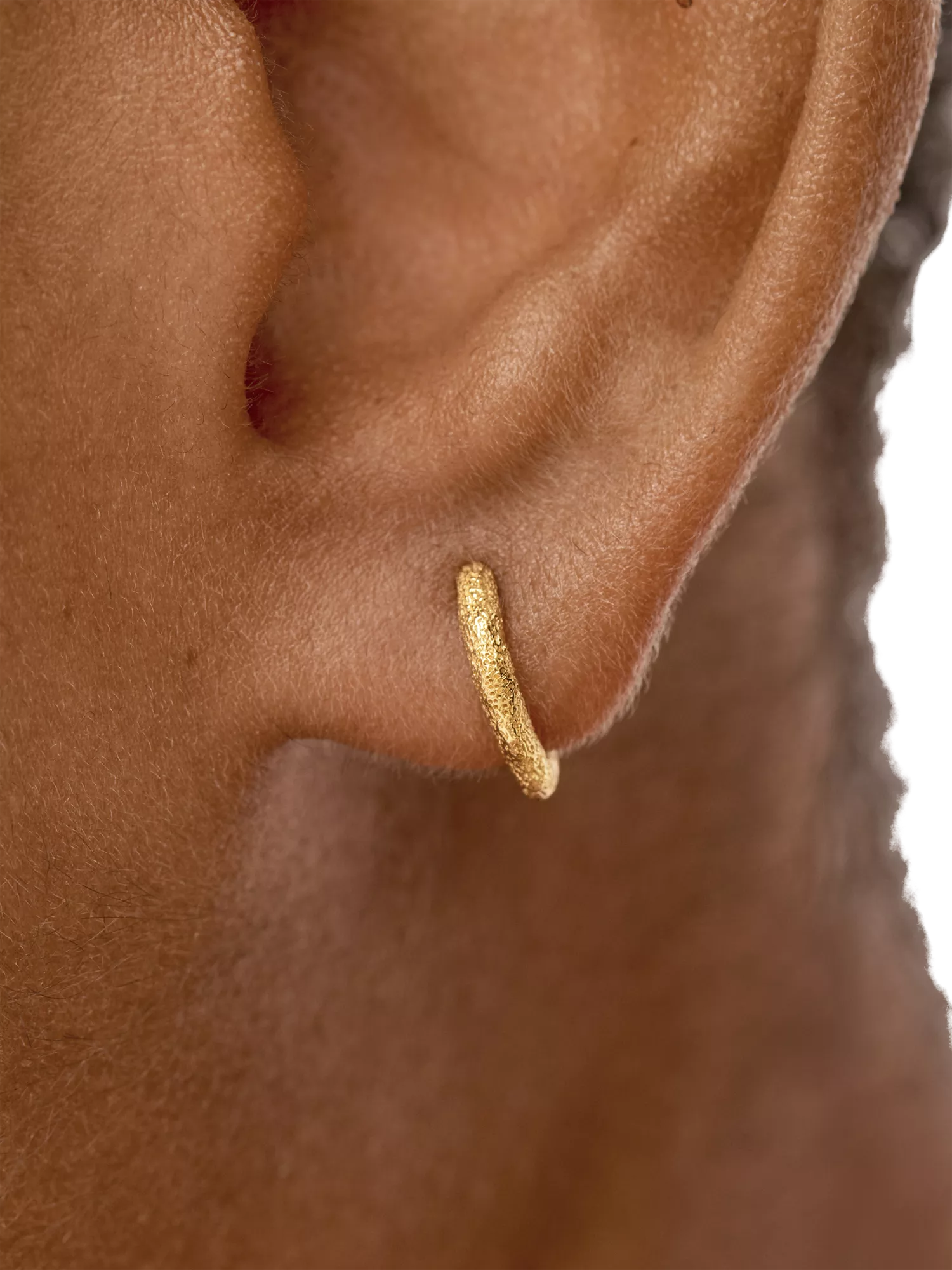 Monica Vinader gold mini huggie hoop earrings, imported from the UK