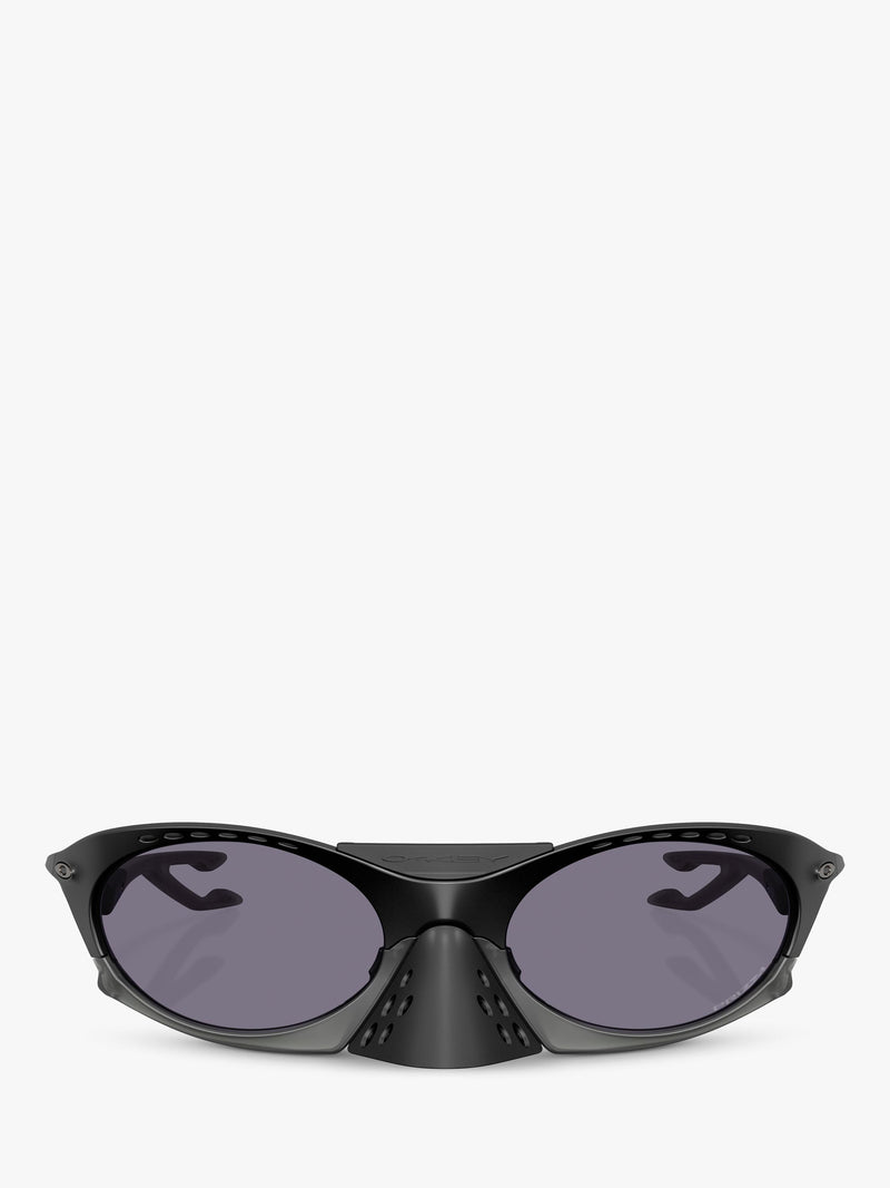Oakley OO9437 tinted oval sunglasses, imported from the UK