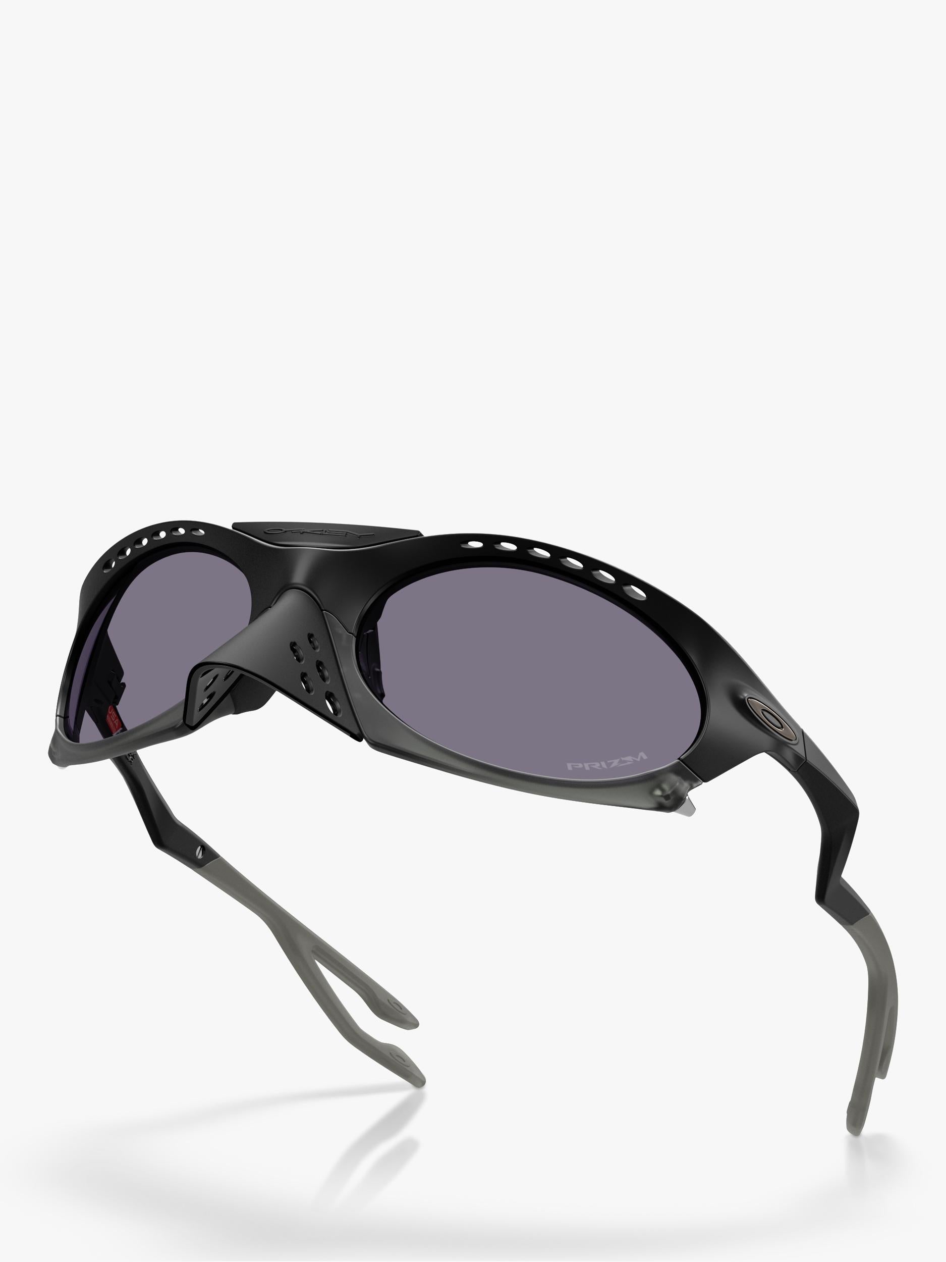 Oakley OO9437 tinted oval sunglasses, imported from the UK