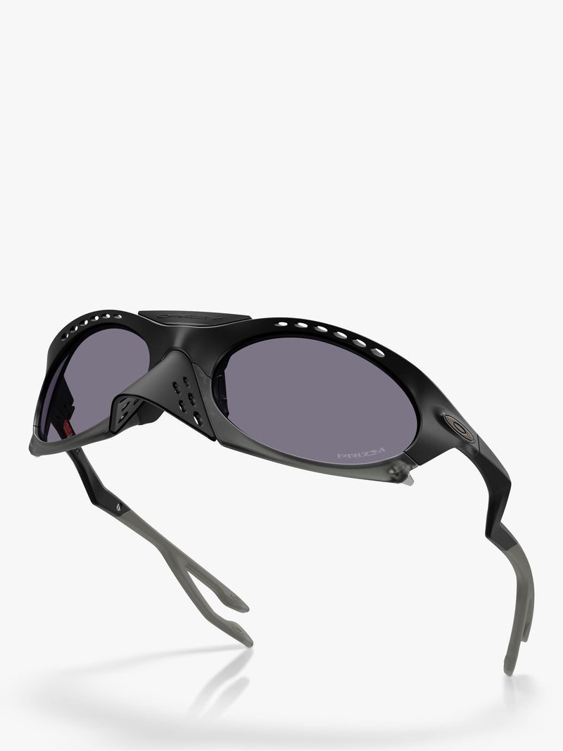 Oakley OO9437 tinted oval sunglasses, imported from the UK