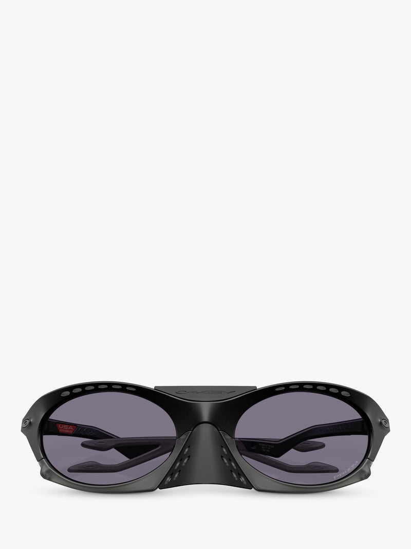Oakley OO9437 tinted oval sunglasses, imported from the UK
