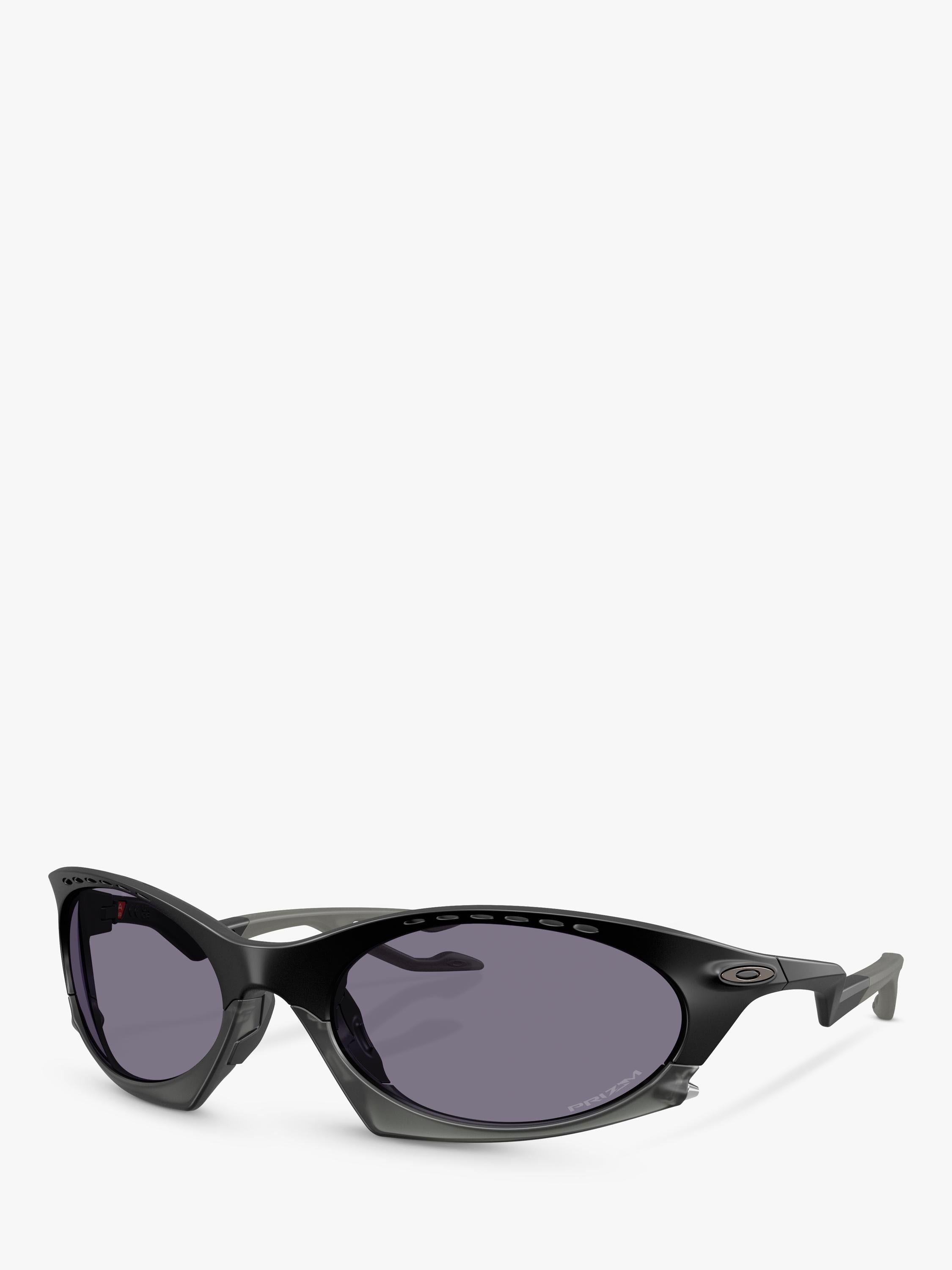Oakley OO9437 tinted oval sunglasses, imported from the UK