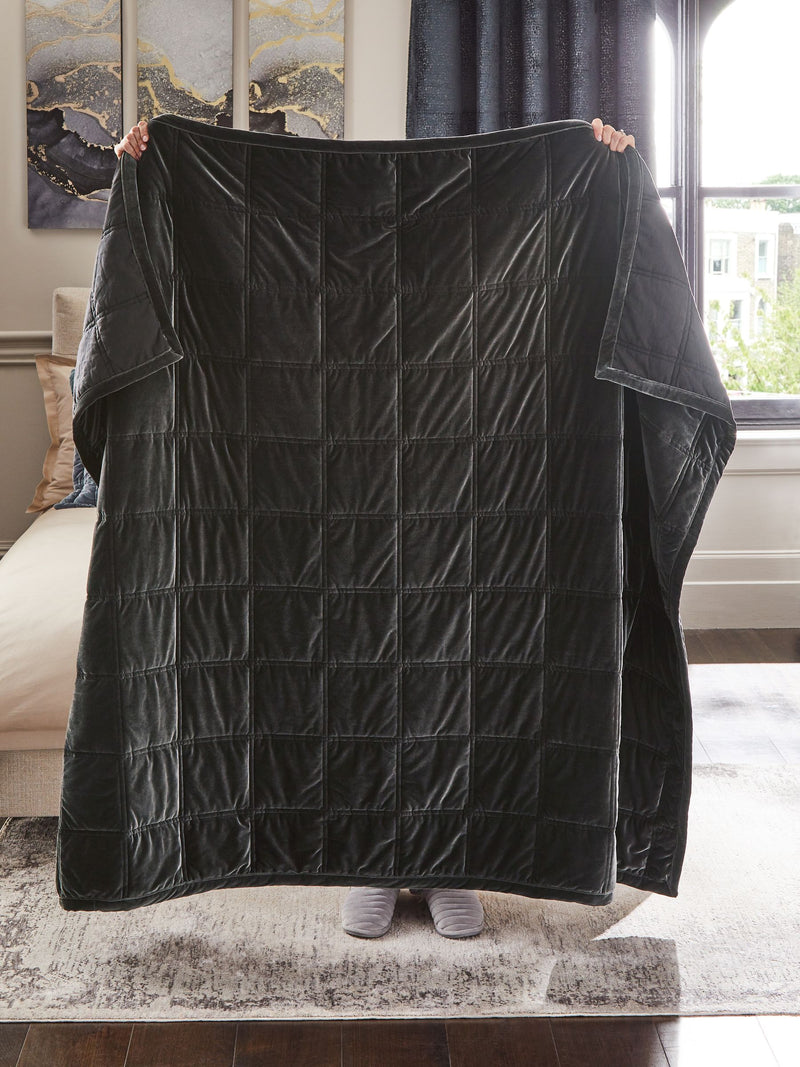 Charcoal grey quilted lustre velvet bedspread, imported from the UK
