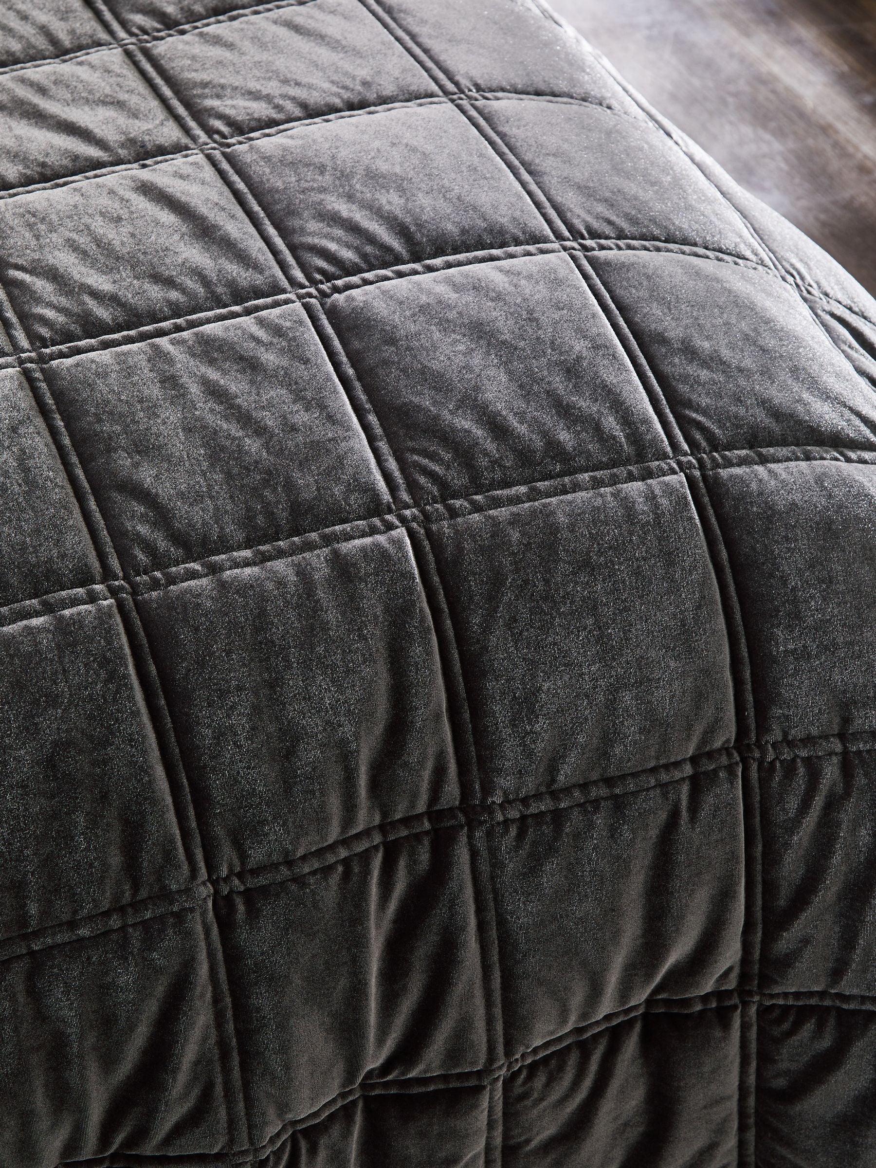 Charcoal grey quilted lustre velvet bedspread, imported from the UK