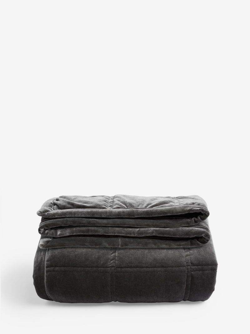 Charcoal grey quilted lustre velvet bedspread, imported from the UK