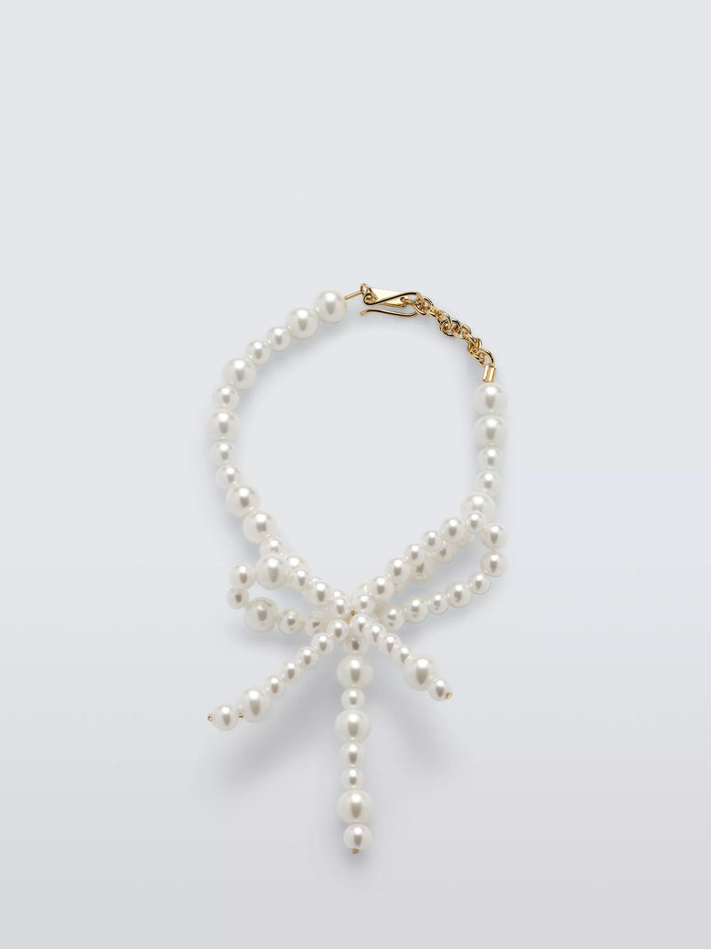 Completedworks glass pearl bow bracelet gold, UK version