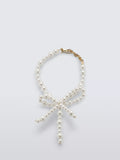 Completedworks glass pearl bow bracelet gold, UK version