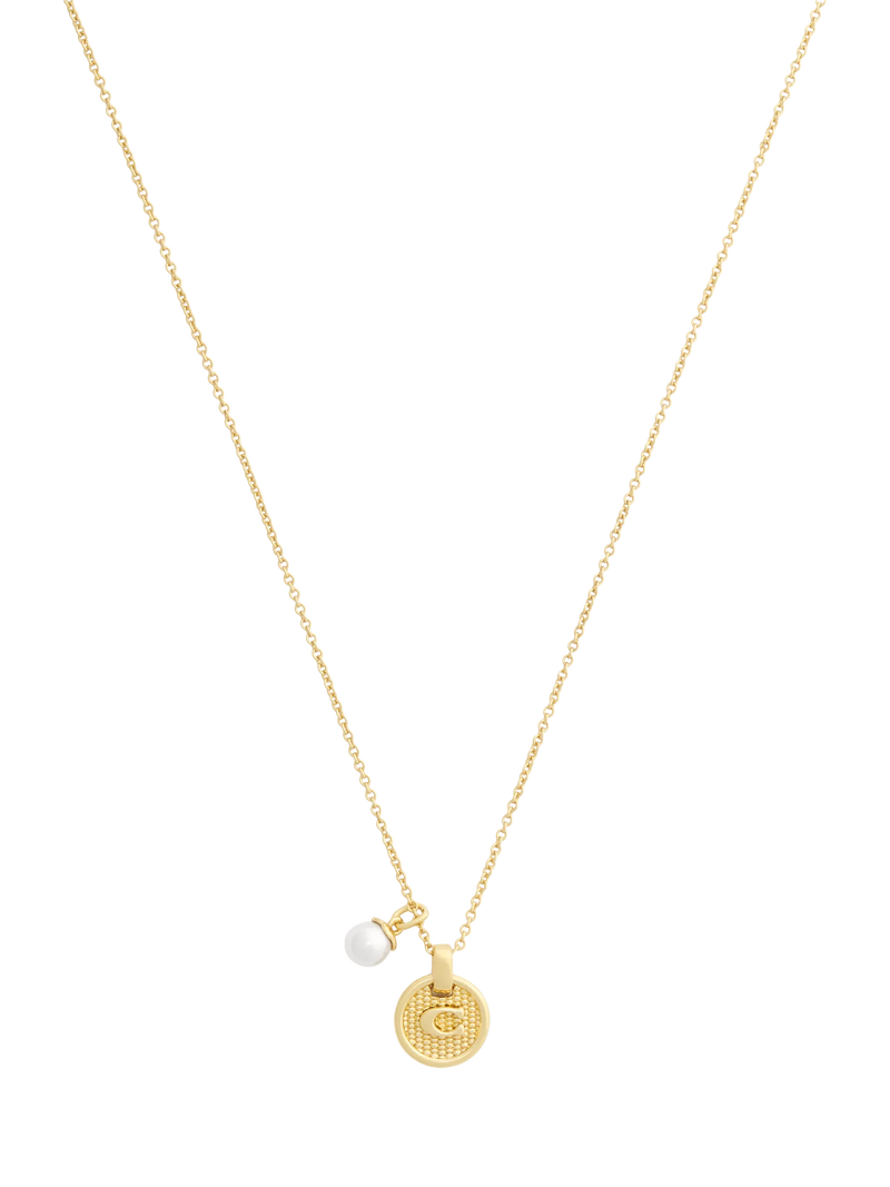 Coach gold-toned disc pendant necklace imported from the UK