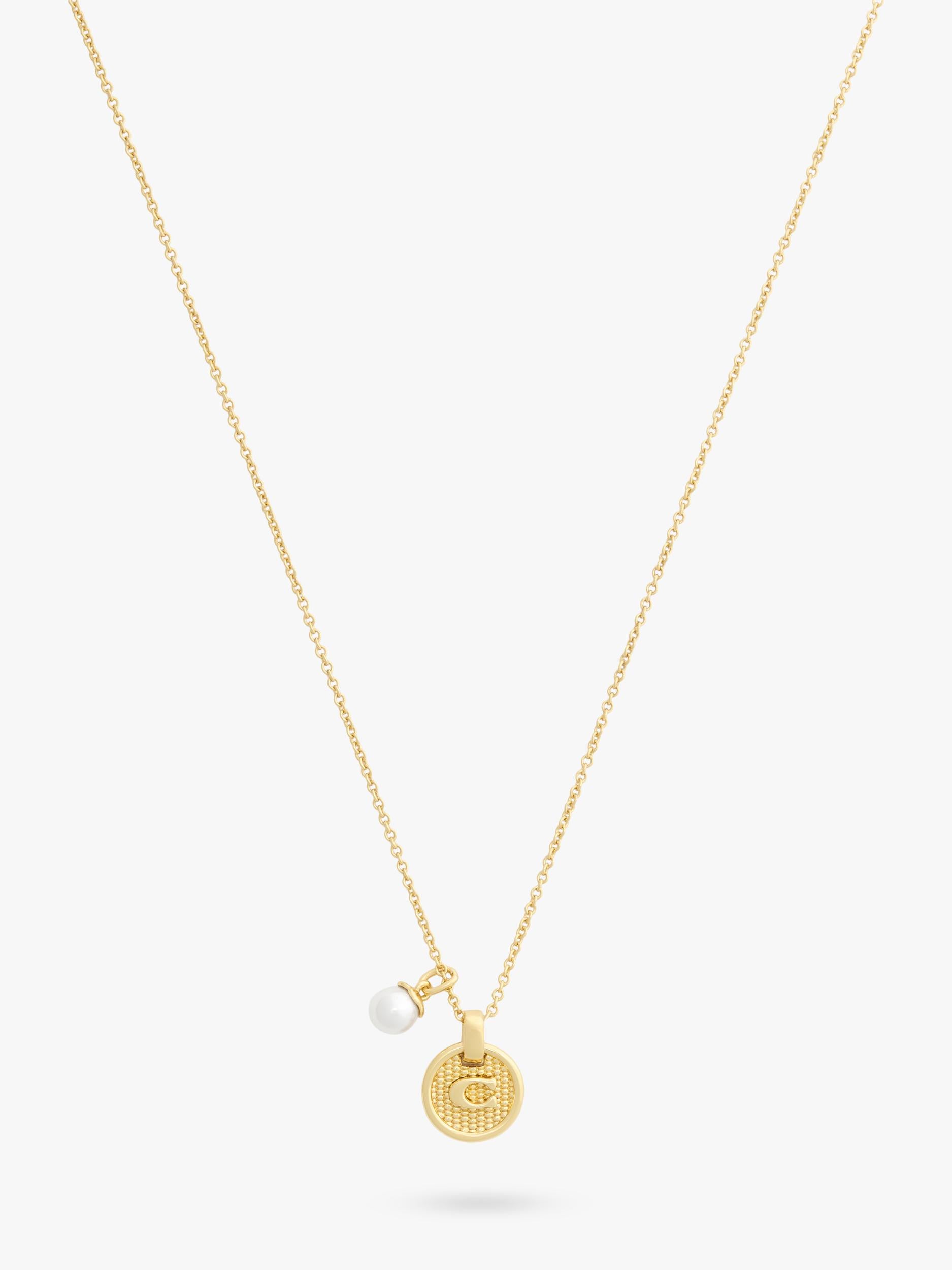 Coach gold-toned disc pendant necklace imported from the UK