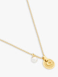 Coach gold-toned disc pendant necklace imported from the UK