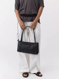 St. Agni minimal black leather pocket bag, UK version