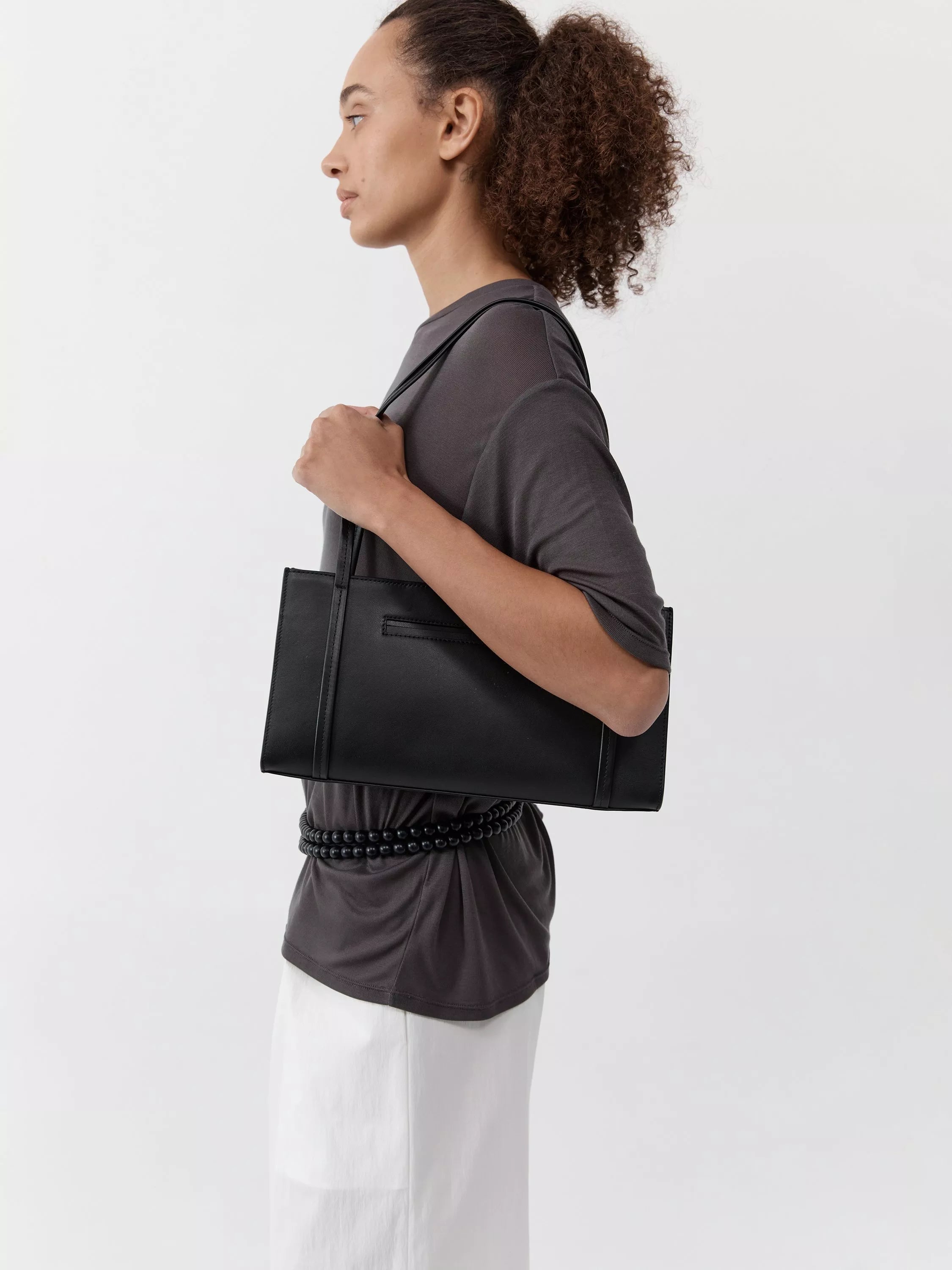St. Agni minimal black leather pocket bag, UK version