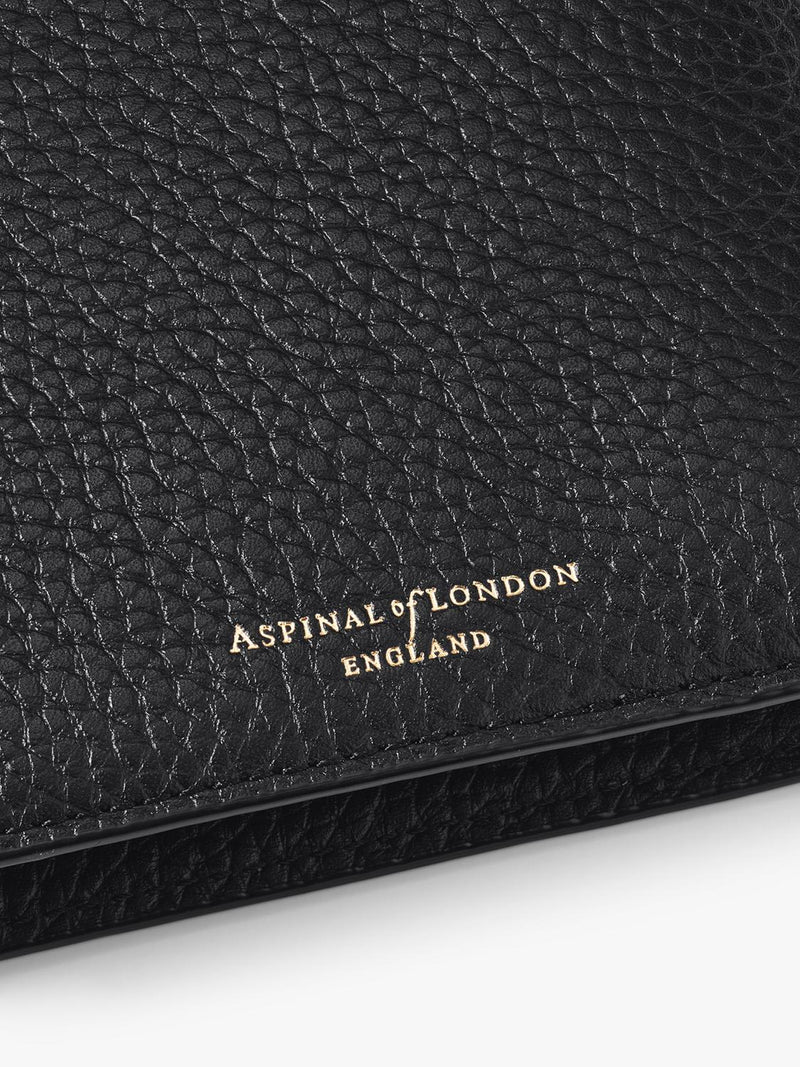 Aspinal of London leather travel wallet with multiple compartments, imported from the UK
