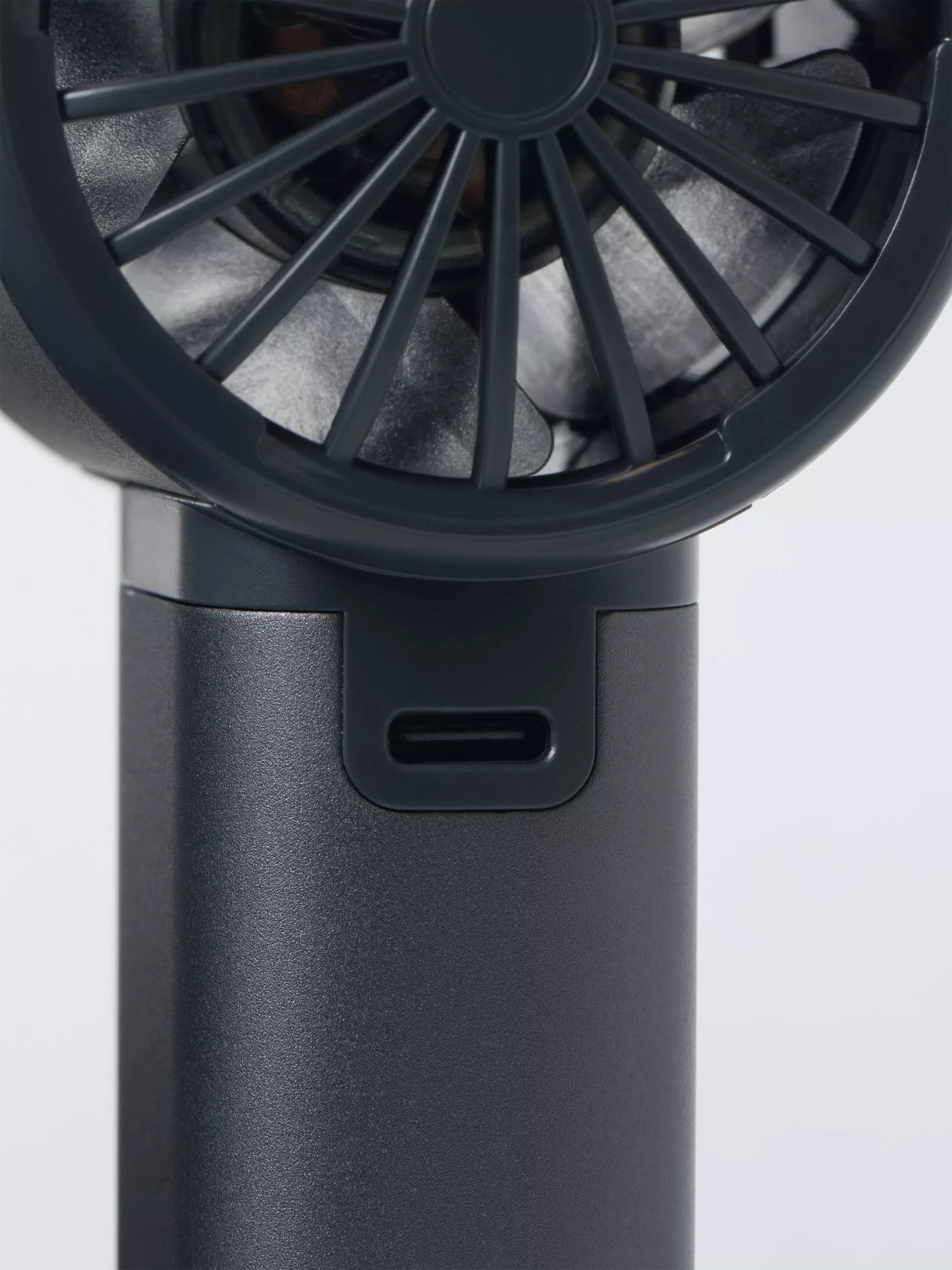 John Lewis handheld fan with aluminium casing, imported from the UK