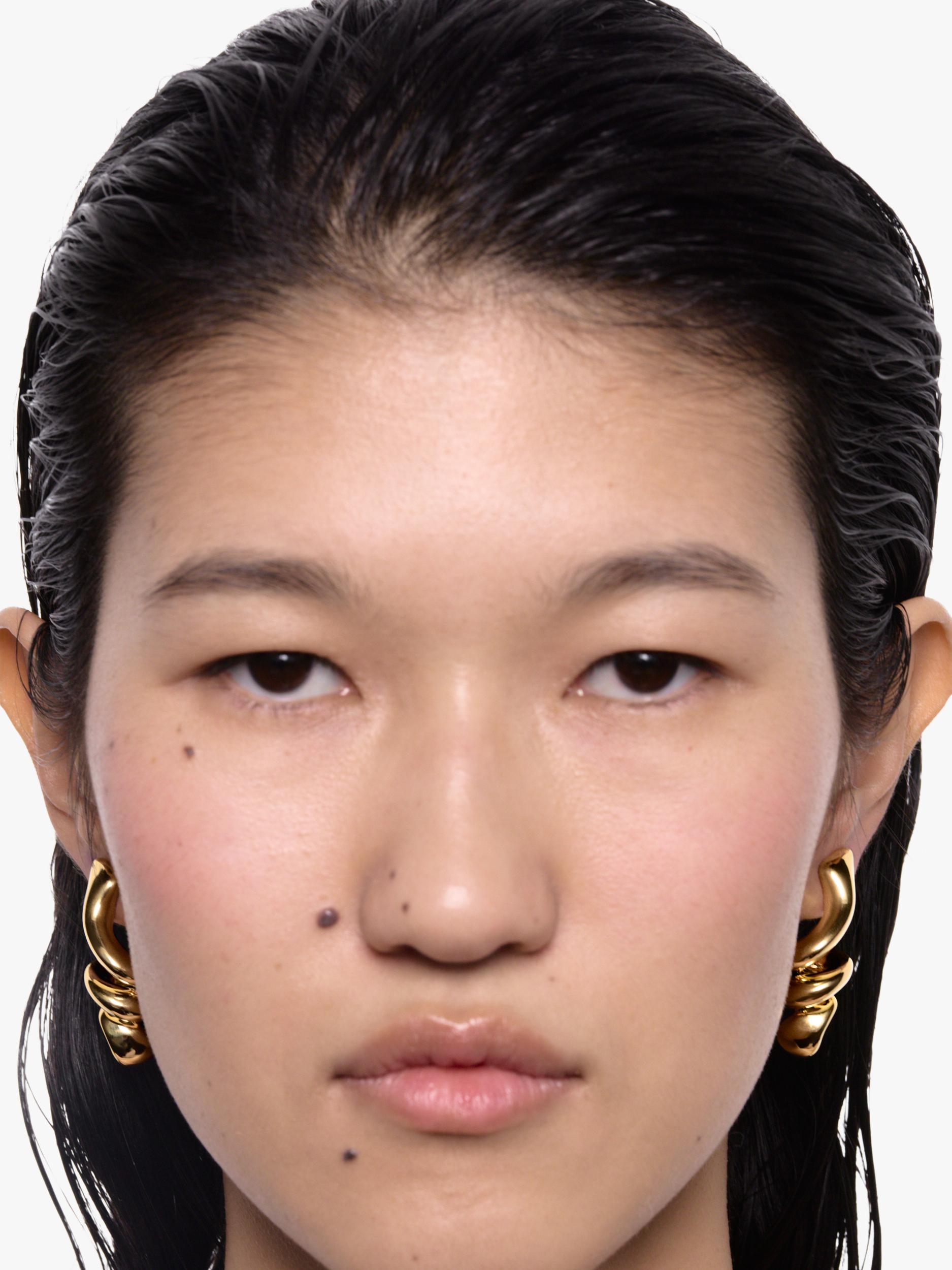 Maria Black coil swirl earrings gold plated, imported from the UK
