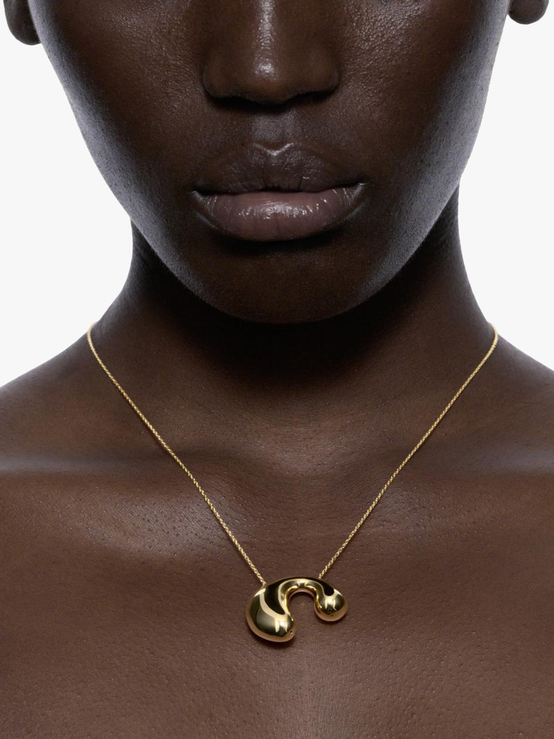 Maria Black biomorphic pendant necklace gold plated 18 carat, imported from the UK
