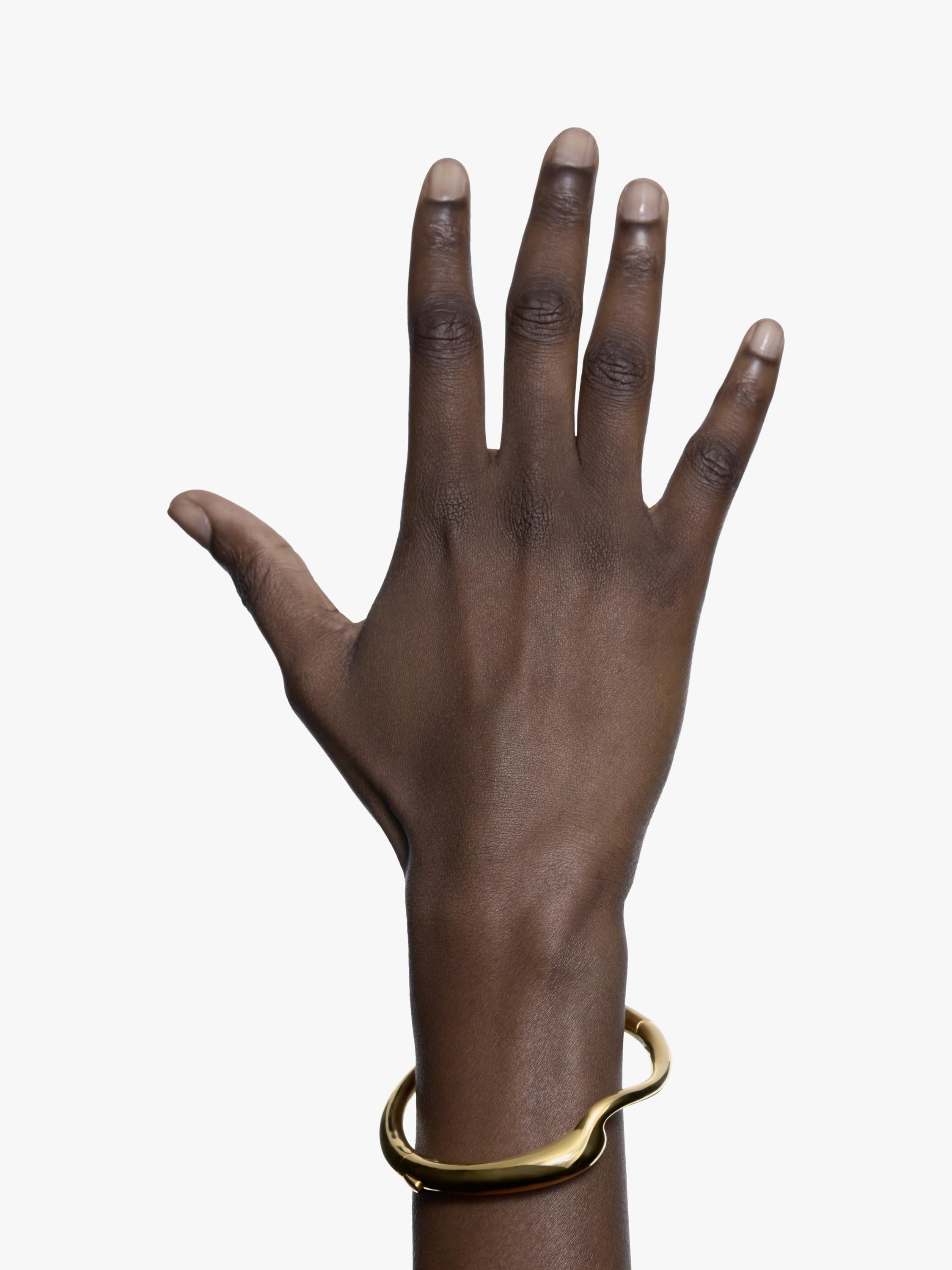 Maria Black gold curved splash bangle (British brand)
