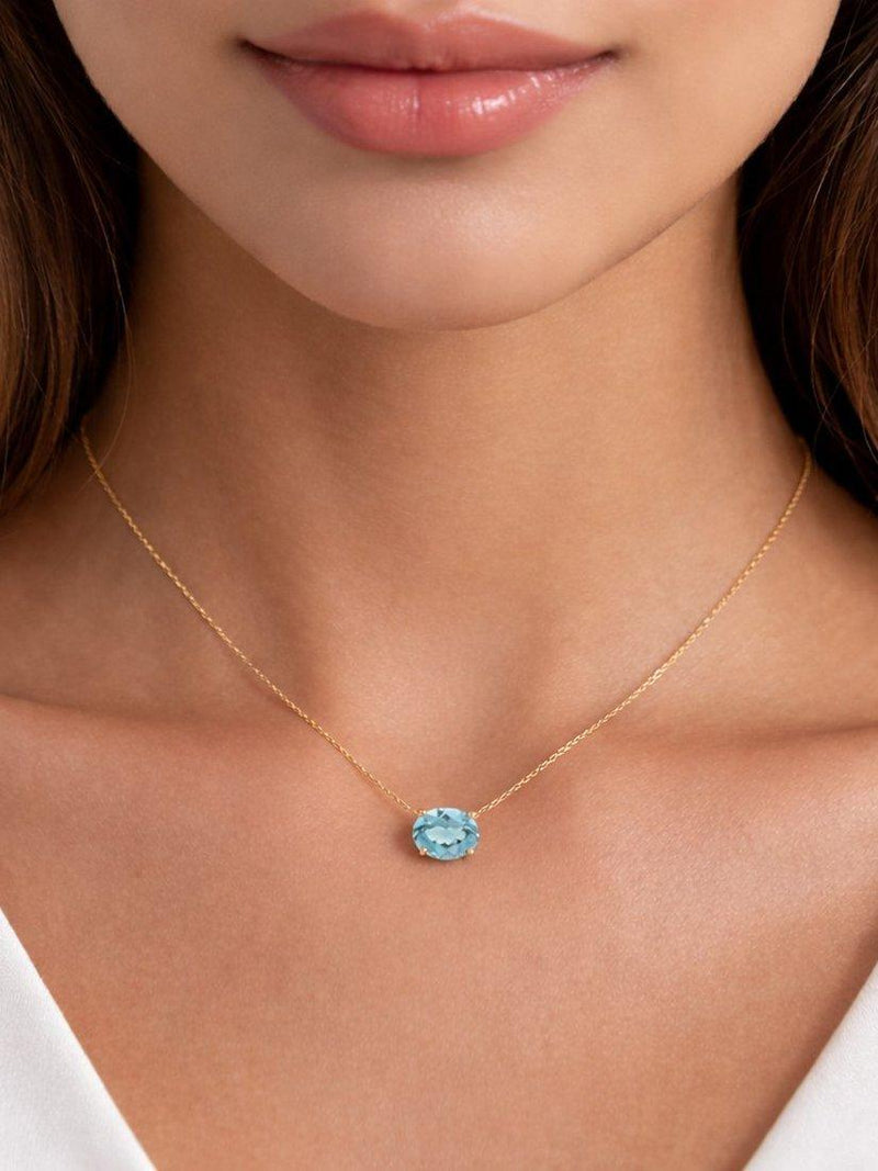E.W Adams blue topaz pendant 9ct gold, UK version